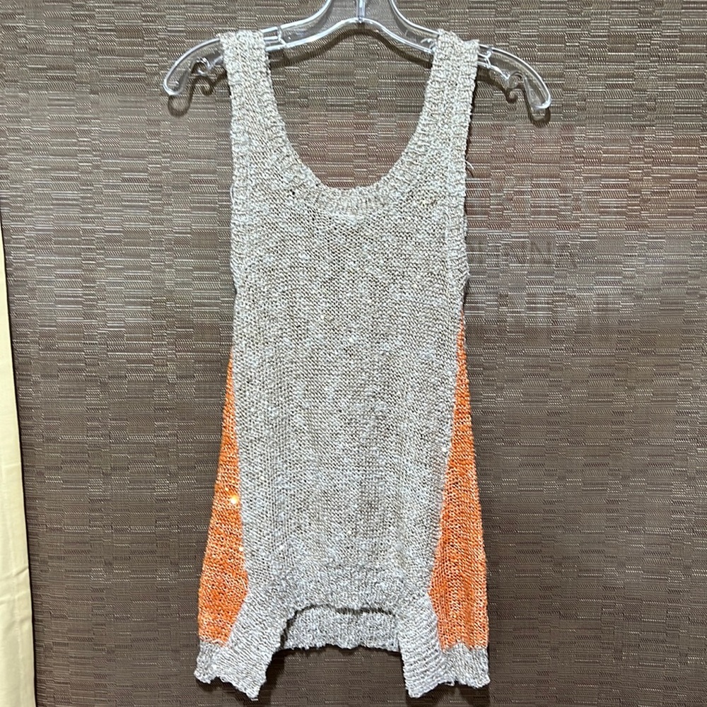 ISSI sleeveless sweater, great A line shape.